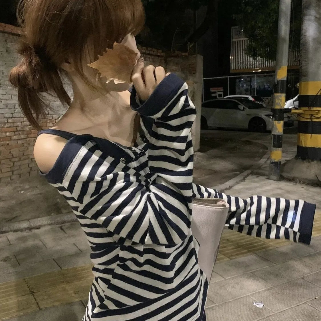 Dark blue Korean-style oversized women's long-sleeved T-shirt with embroidery and stripe details.
