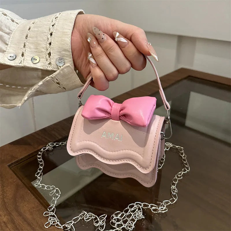 Mini crossbody bag in PU material with adjustable strap available in seven colours
