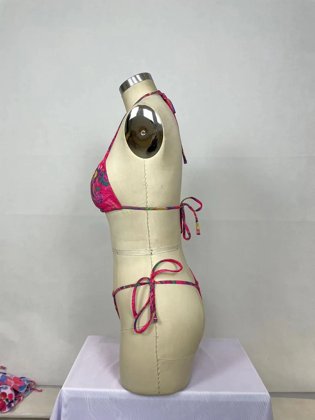 Pink women's two-piece bikini swimsuit set with briefs styling
