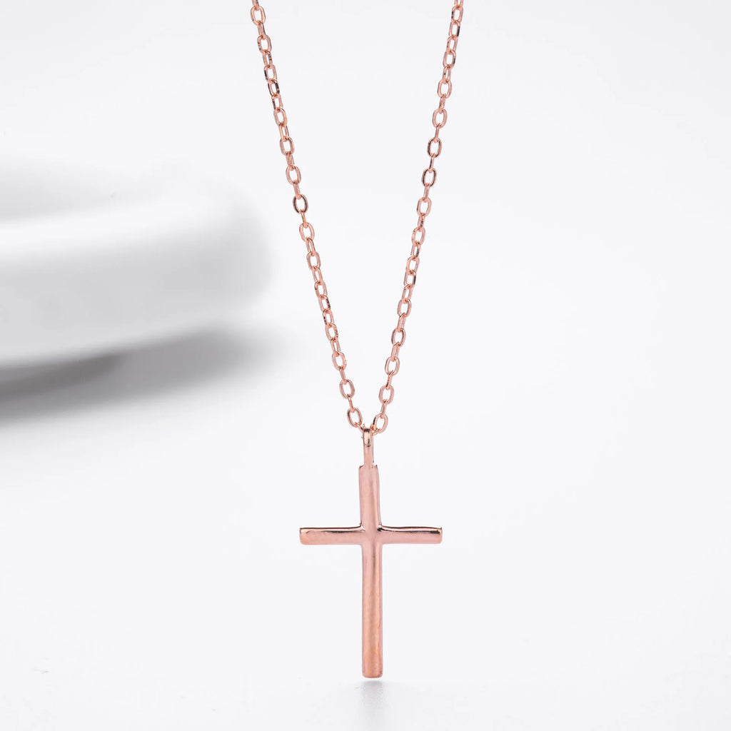 S925 sterling silver necklace with a simple glossy cross pendant on an O-shaped clavicle chain.