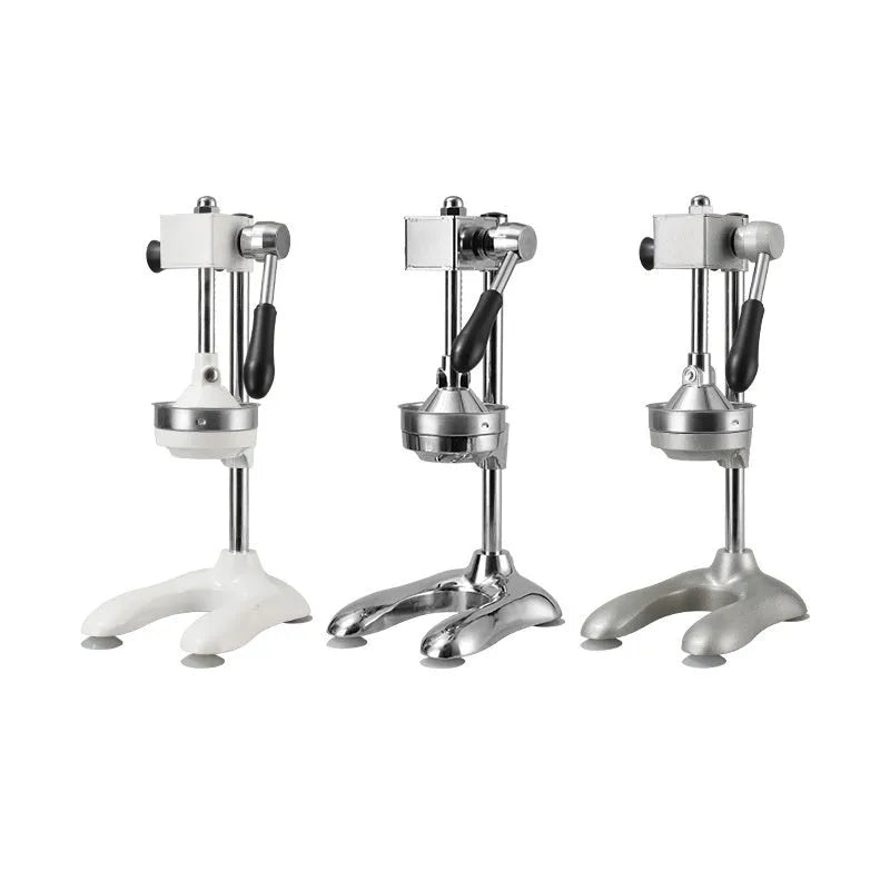 A vertical stainless steel manual citrus juicer on a kitchen counter, showing different colour and head style options.