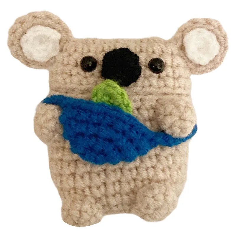 Handmade knitted koala bear backpack design cover on an AirPods case.