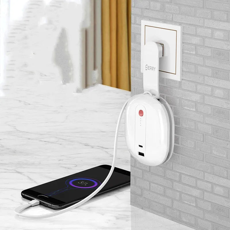 White and black power bank with integrated wall plug showing compact square design