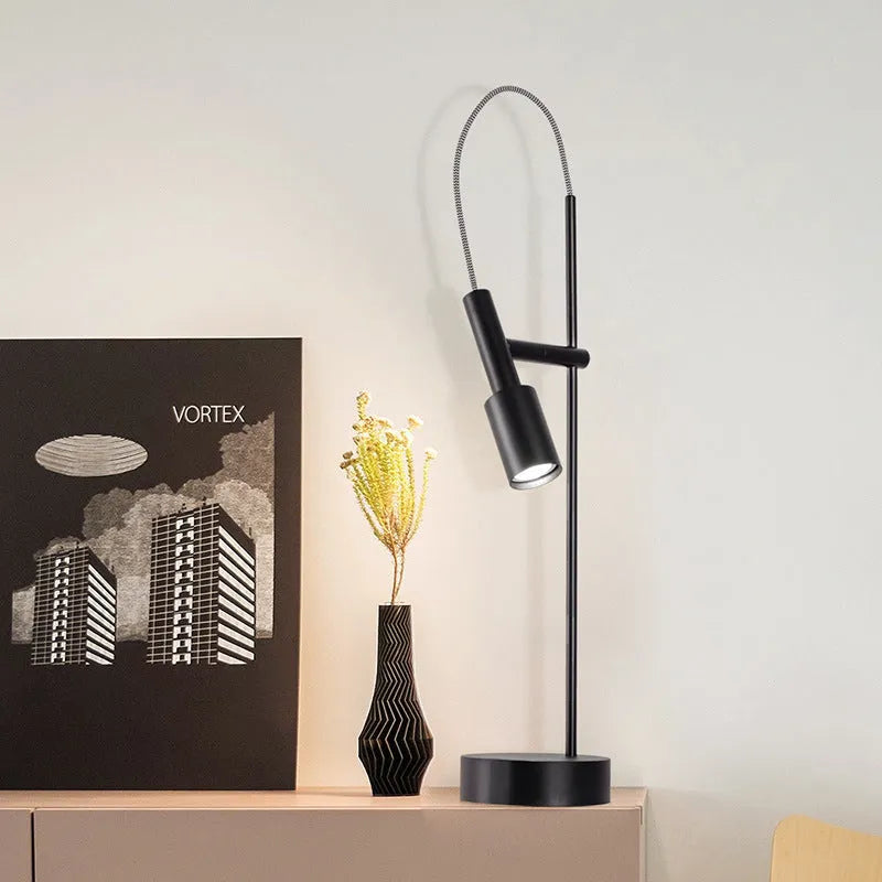 Simple modern rotating table lamp in sand black finish with wrought iron base and adjustable head