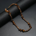 Men's hand-woven bohemian necklace with turquoise, shell white, and tiger stone beads and crystal pendant on adjustable cord