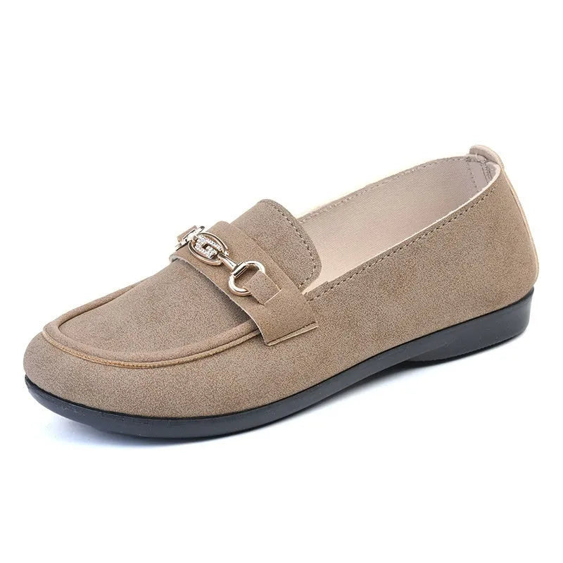 Women's black matte slip-on casual shoes with a round toe and soft rubber sole on a flat surface.