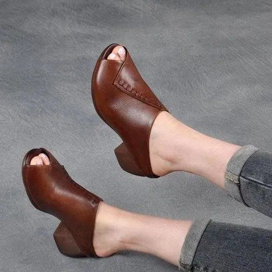 Women's black peep-toe slipper with a square heel and fish mouth opening, shown on a white background.