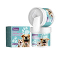 Green and white dog dental cleaning glove with finger muffs for tartar removal, shown with packaging.