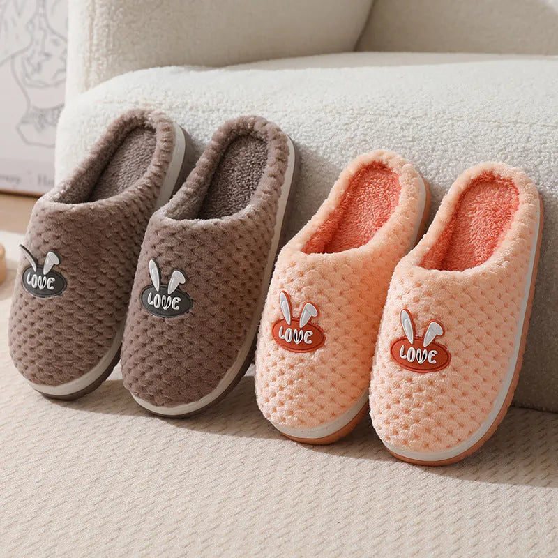 Women's rabbit plaid patterned artificial fur slippers with a thick sole and non-slip rubber base.