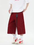 Retro multi-pocket denim workwear shorts in wide-leg cropped style