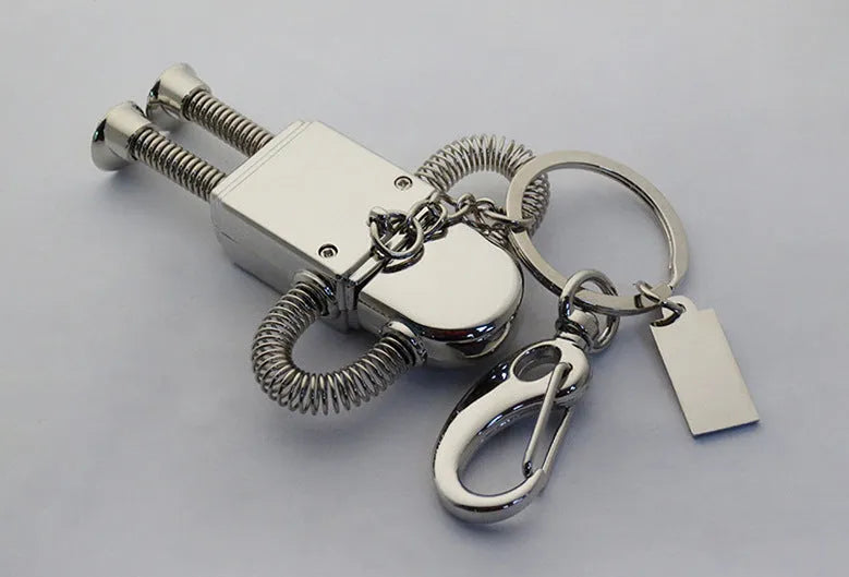 Metal robot U disk in silver with spring-extended USB connector on a white background