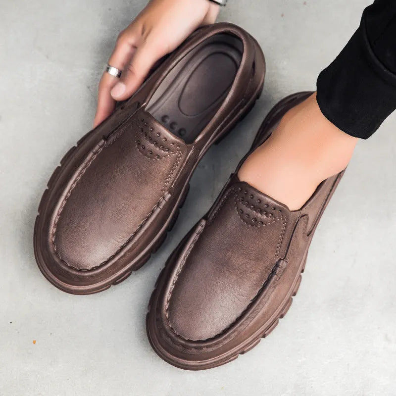 Men's black slip-on work shoes with a platform sole and round toe.