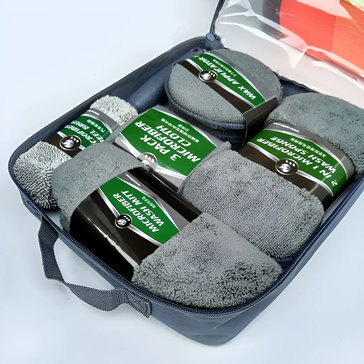 9-piece car wash cleaning kit with polyamide towels, sponge, tyre brush, and waxing cakes in dark grey and orange