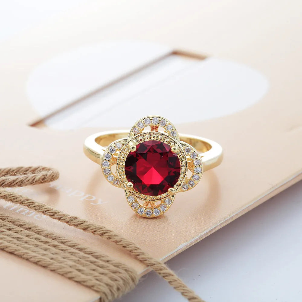 Copper fruit-shaped ring with zircon detail, showing electroplated finish.