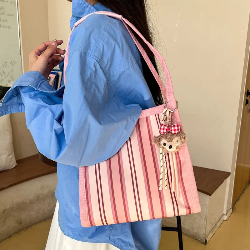 Women's large-capacity urban simplicity tote bag in blue, green, khaki, and pink with internal phone pocket and double shoulder straps