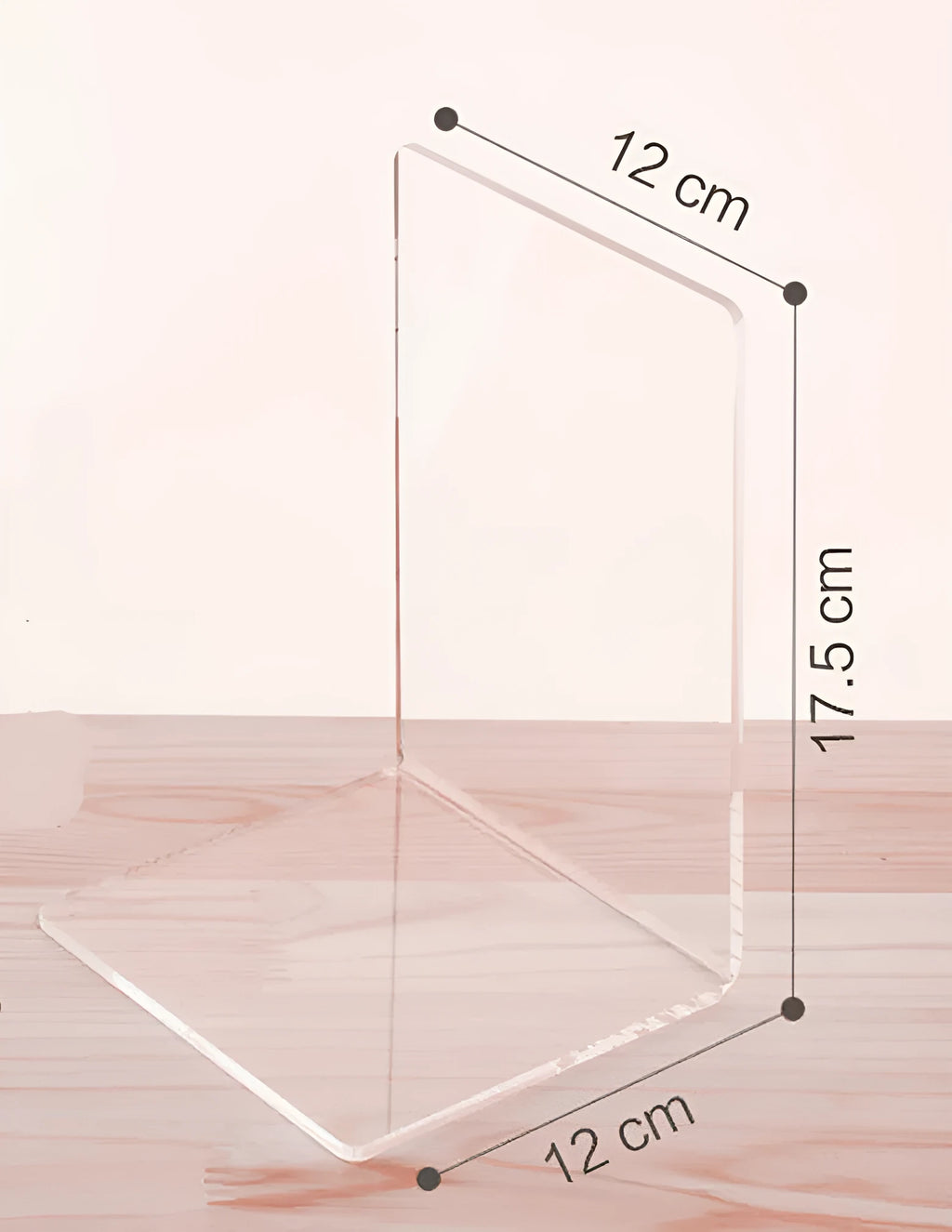 Transparent acrylic bookshelf display rack on a desk holding two books.
