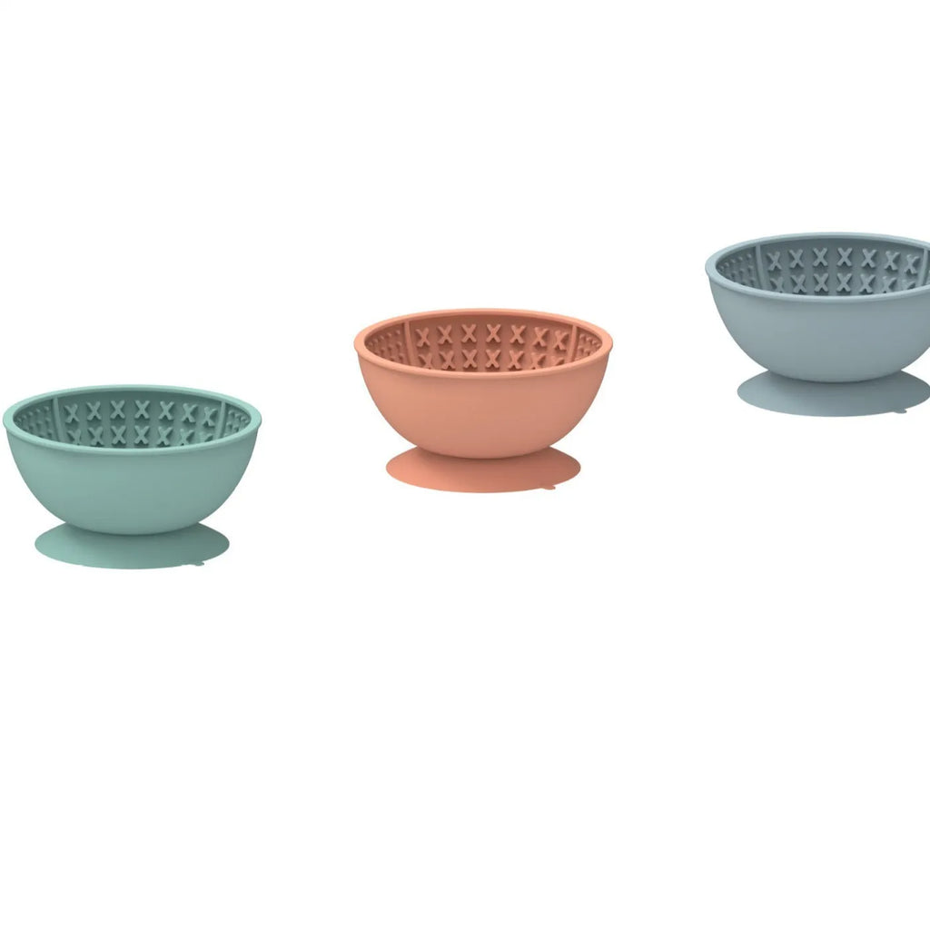 Cyan silicone dog slow feeder bowl with suction cup base and textured licking mat surface