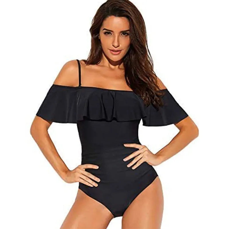 Black one-piece swimsuit with ruffled straps and cut-out details on a mannequin.