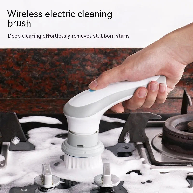 White cordless electric cleaning brush with multiple brush heads on charging dock