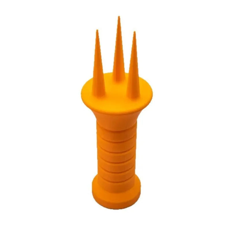 Home gardening soil aerator plastic hand tool in orange, 3.3cm x 10cm size, on soil
