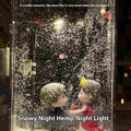 DIY Christmas night light kit showing snowy landscape scene with glowing street light and flowing snow effect