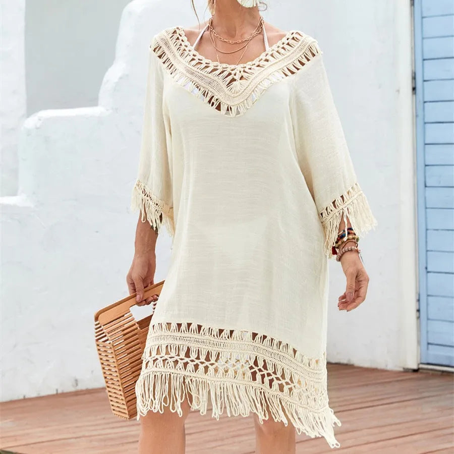 Apricot coloured crocheted patchwork women's dress with half sleeves and a mid-length skirt.