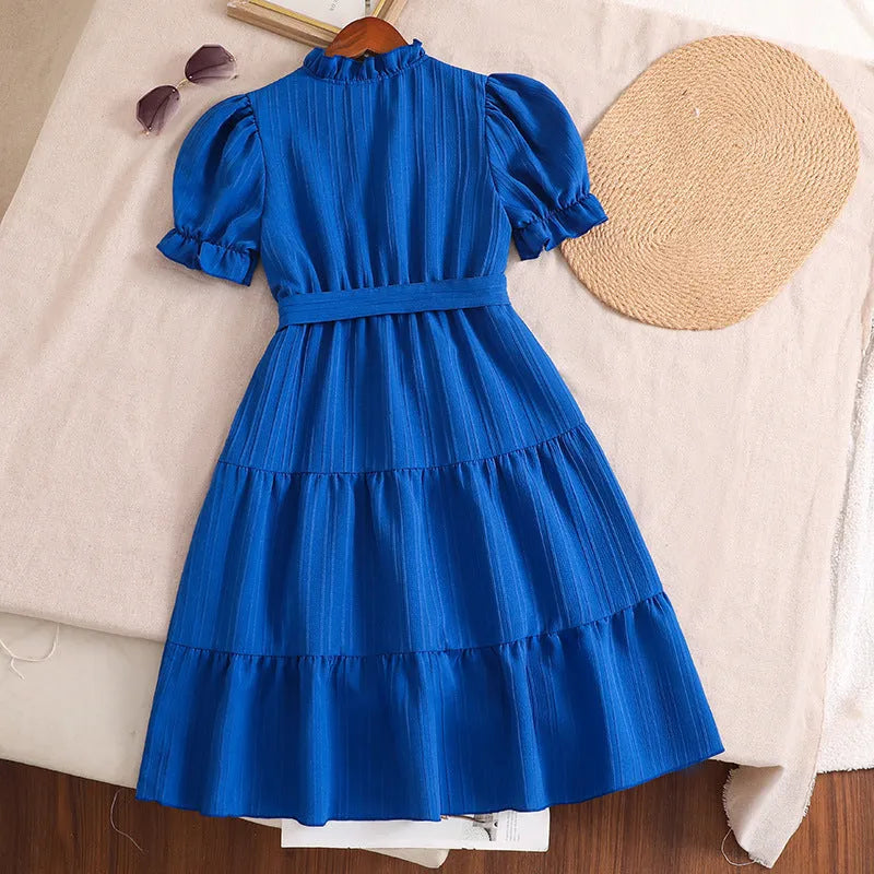 Girls' blue V-neck puff sleeve lace-up dress with A-line skirt and cotton blend fabric, summer style.