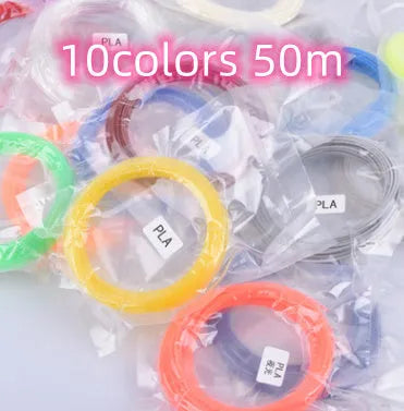 Yellow 3D printing pen with 12 colour PLA filament spools and UK power adapter on a white background