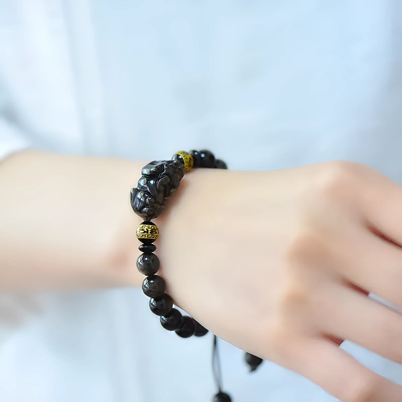 Golden obsidian Pi Xiu bracelet with hand-woven beads in Chinese animal zodiac style