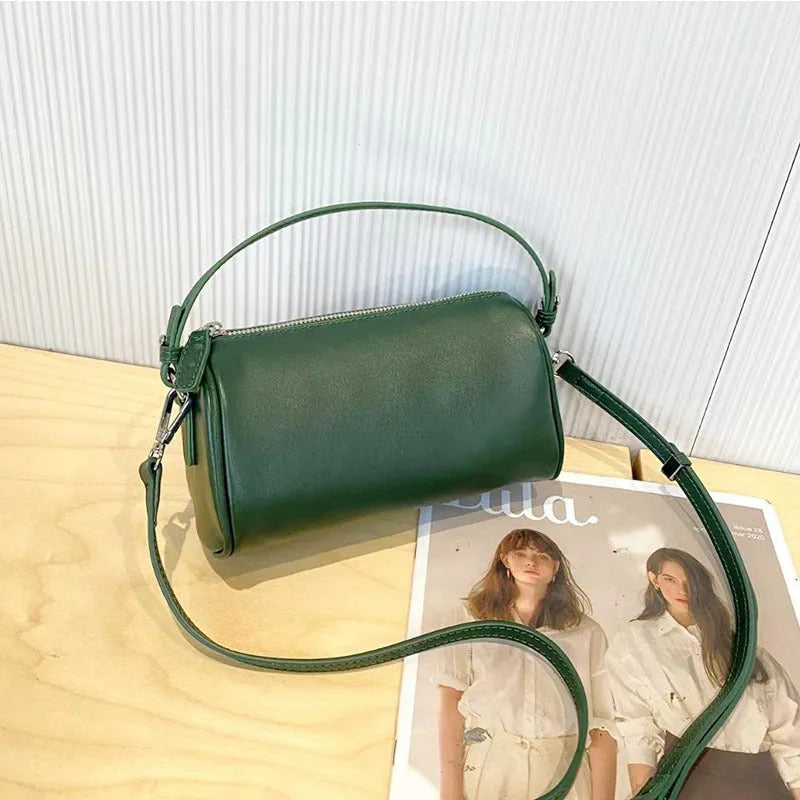 Genuine leather mobile phone crossbody bag with cylindrical design in six colour options showing sewing thread detailing