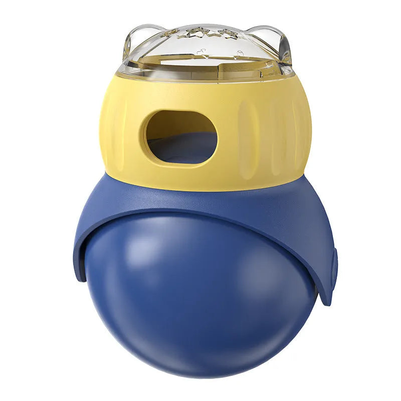 Morandi yellow and blue owl-shaped plastic tumbler cat toy with a snap-fit lid, on a wooden floor.