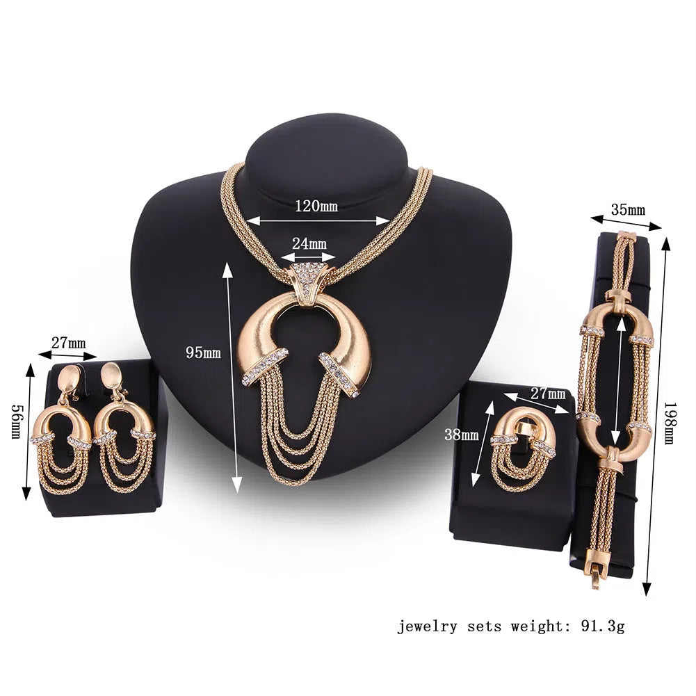 Four-piece alloy bridal jewellery set in 18K gold colour with artificial gem inlay and extension chain
