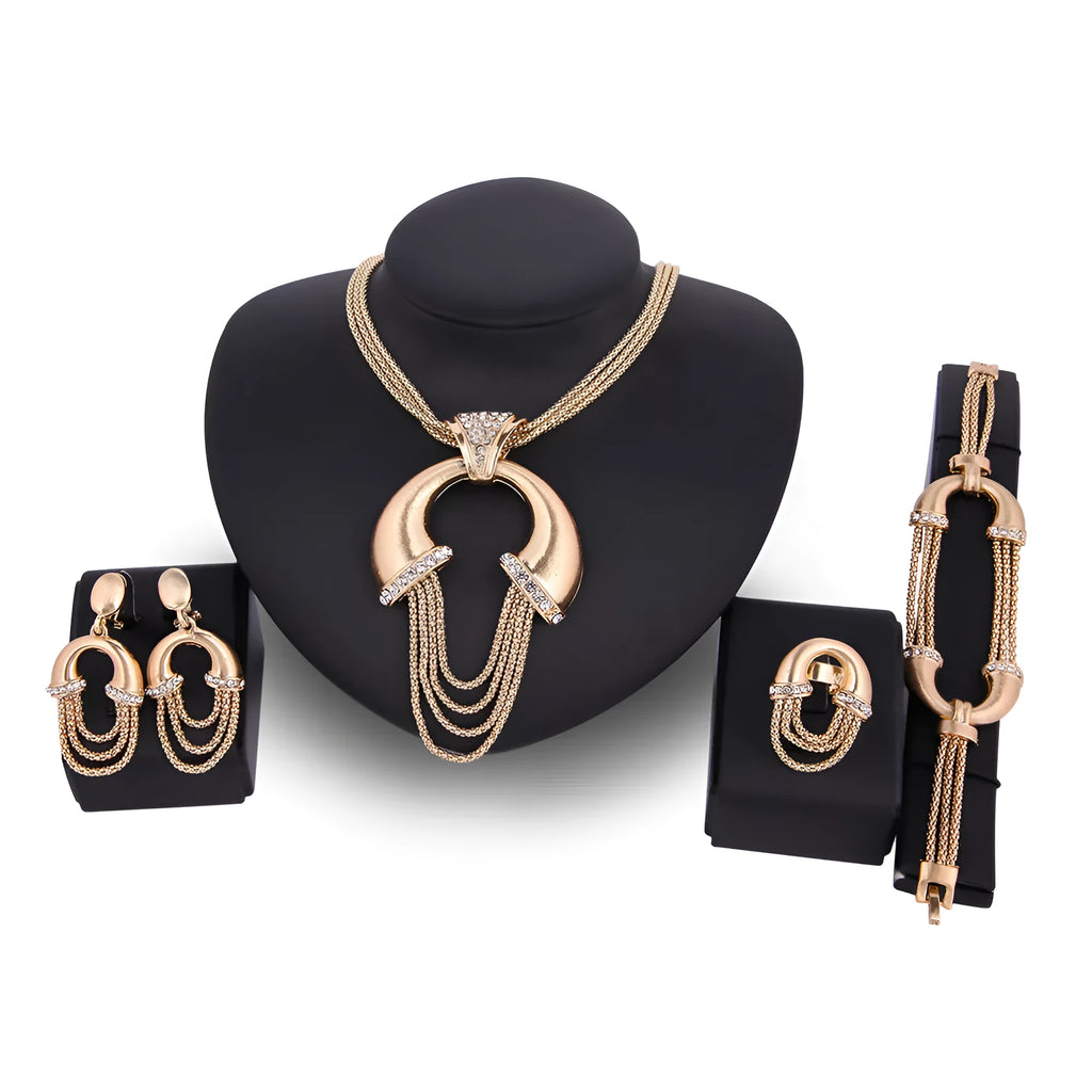 Four-piece alloy bridal jewellery set in 18K gold colour with artificial gem inlay and extension chain