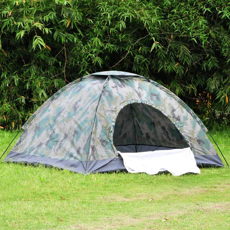 Green camouflage two-person tent with mesh windows, pitched outdoors.