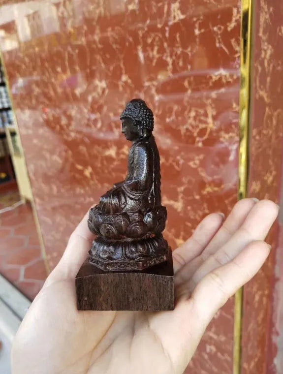 Hand-carved Sakyamuni Buddha statue in natural black wood, 30cm tall, for home or office display