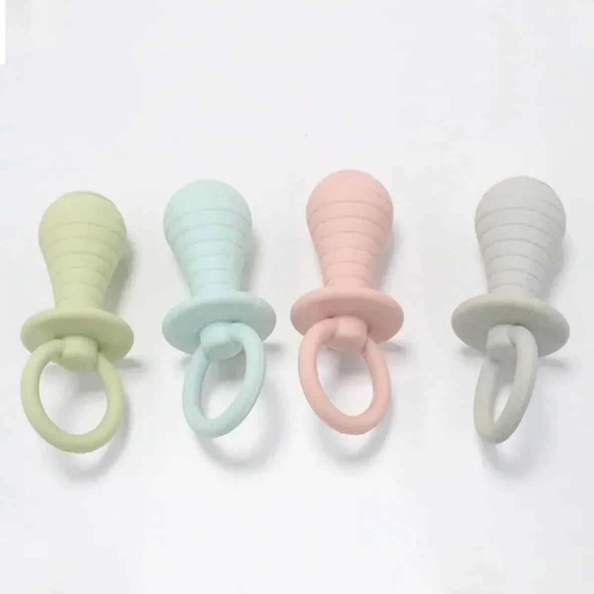 Four coloured pet pacifier rubber toys with squeakers for puppies and kittens