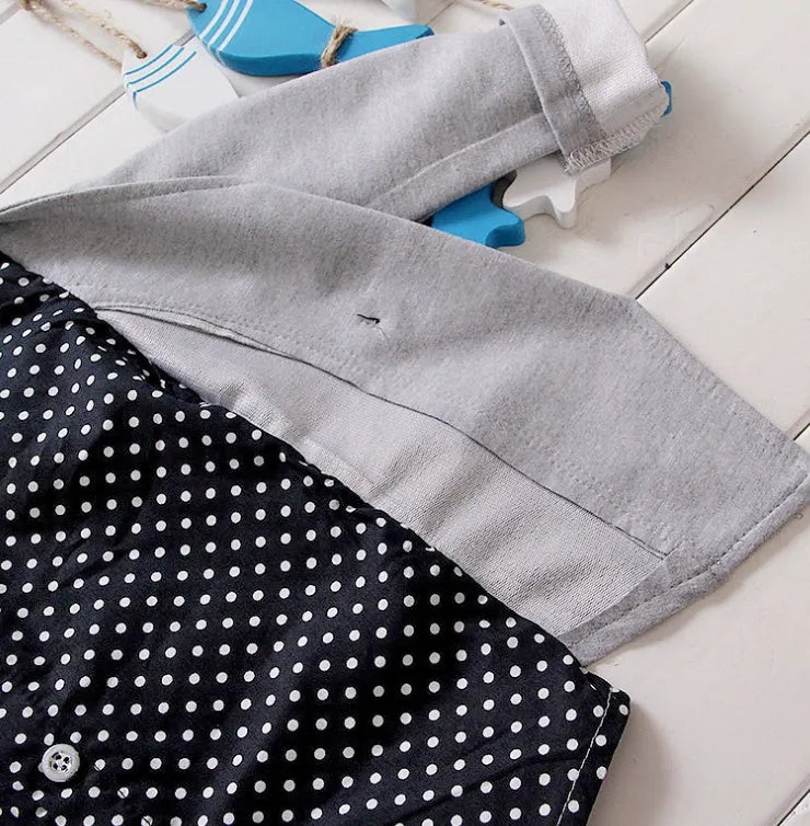Casual blue kids sport suit set with short sleeves and elasticated waist shorts on a hanger