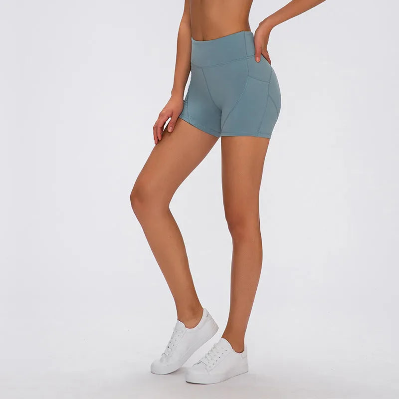 SHINBENE high waisted women's athletic shorts in black with two side pockets, soft cotton blend fabric