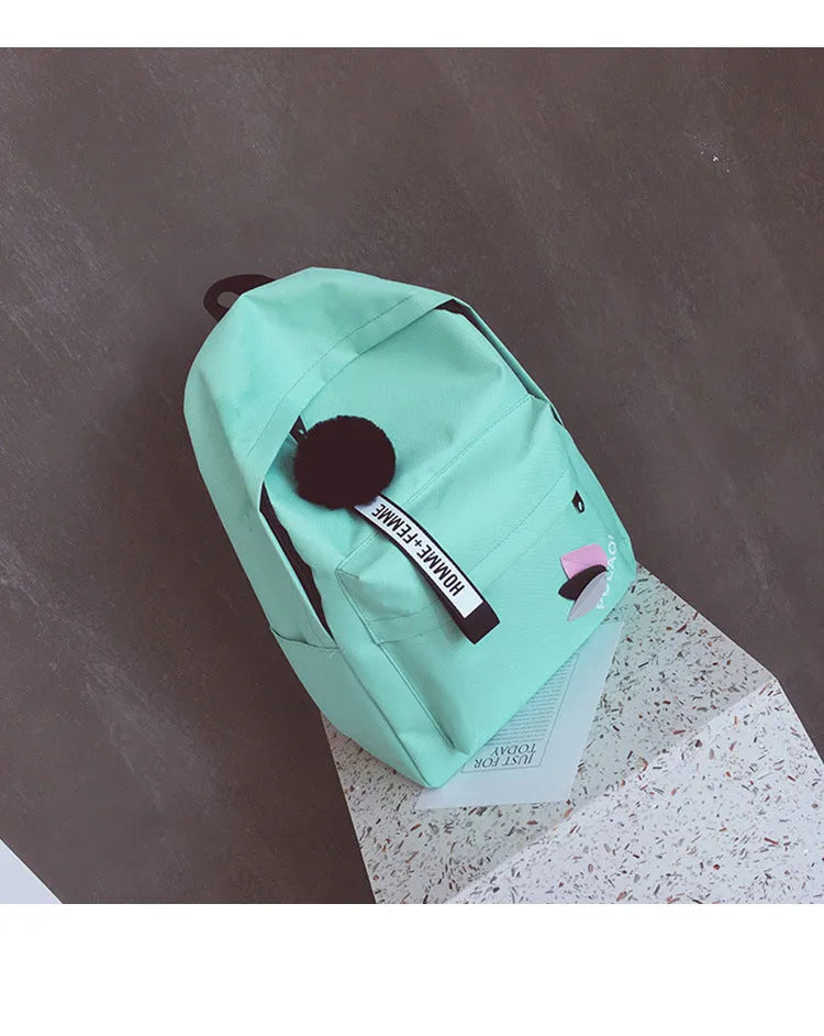 Women's canvas college backpack in green with 20-35L capacity and anti-theft design