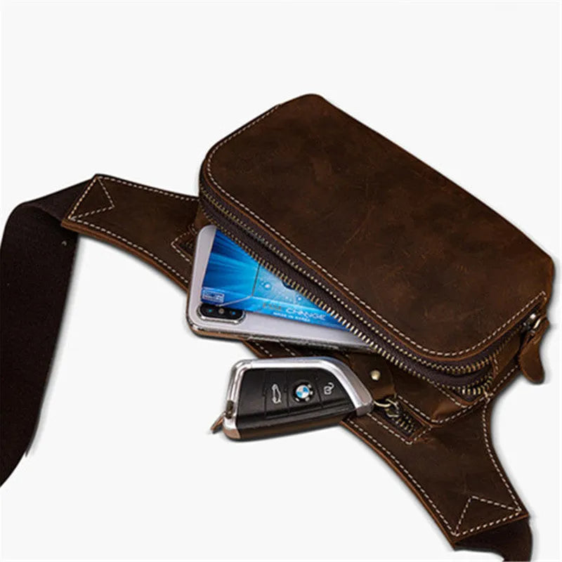 Brown cowhide leather men's waist bag showing pull-closure, worn on hip, with internal phone pouch visible.