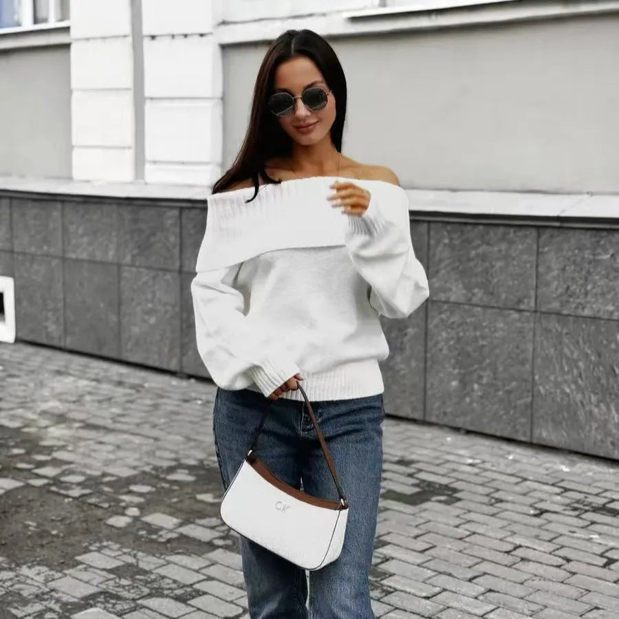Grey off-the-shoulder sweater with a 3D pattern texture on the fabric.