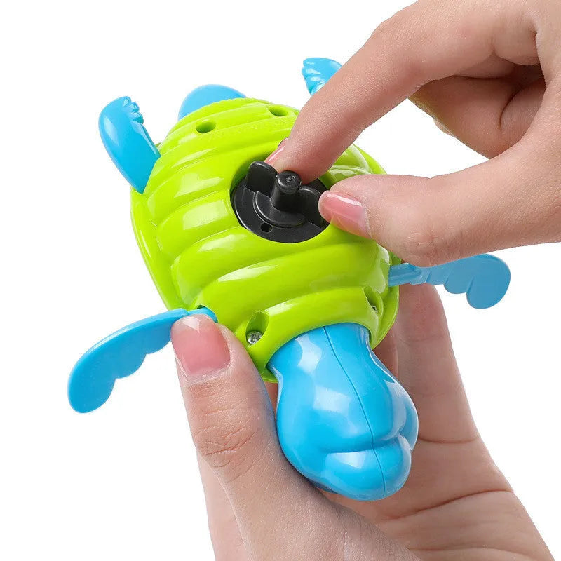 Plastic baby tortoise bath toy floating in water for infant bath time play