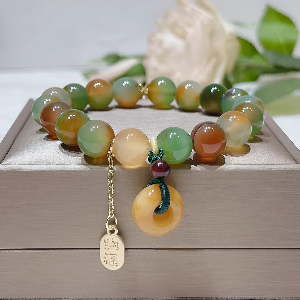 Women's peacock agate and topaz bracelet with a traditional peace buckle clasp.
