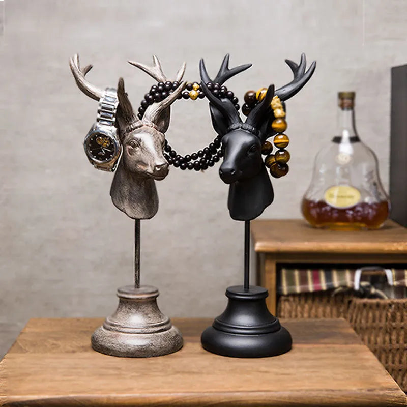 A solid natural resin animal-shaped home decoration in black, shown from the side.