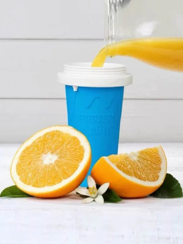 Blue cylindrical silicone pinch cup for making instant slushy smoothies.