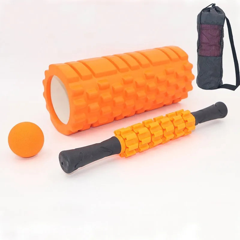 Black 33cm fitness foam roller and massage stick set on a grey background.