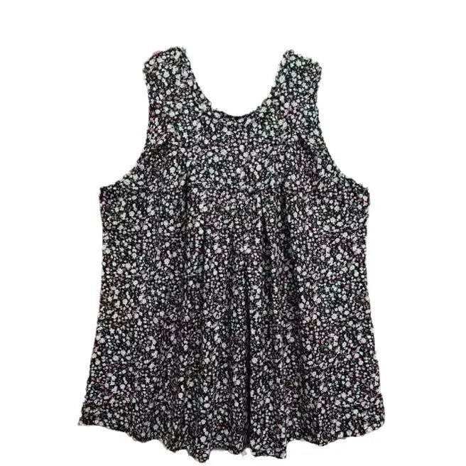Black plus size sleeveless vest with white floral print, showing loose fit and round neckline.