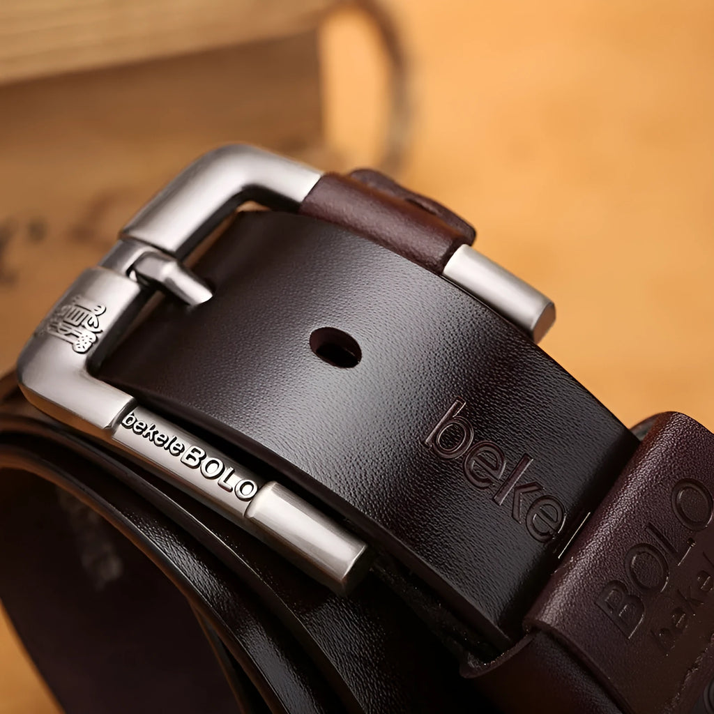 Men's cowhide leather belt with round alloy pin buckle, black colour, on a flat surface