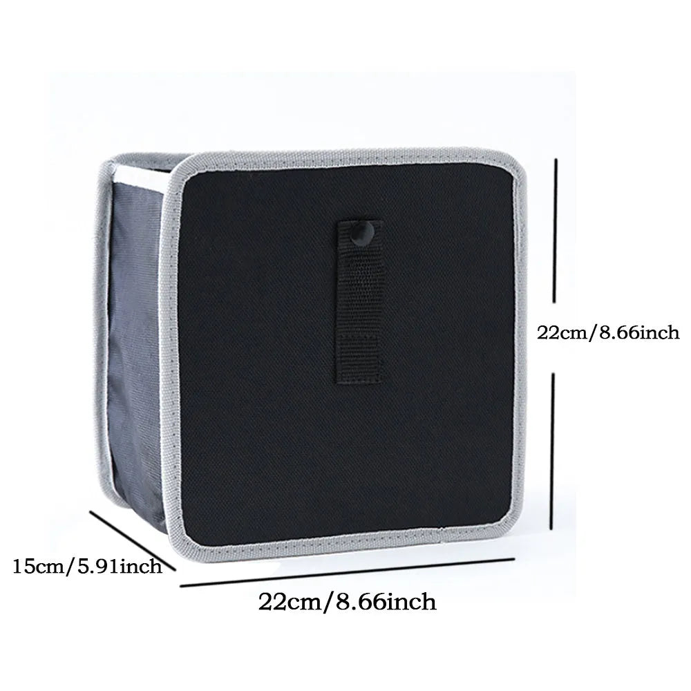 Foldable Oxford car wastebasket 22x22x15cm hanging from car seat with snap closures