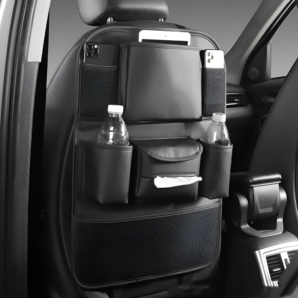 Black PU leather car seat back storage bag hanging on a grey car seat headrest.